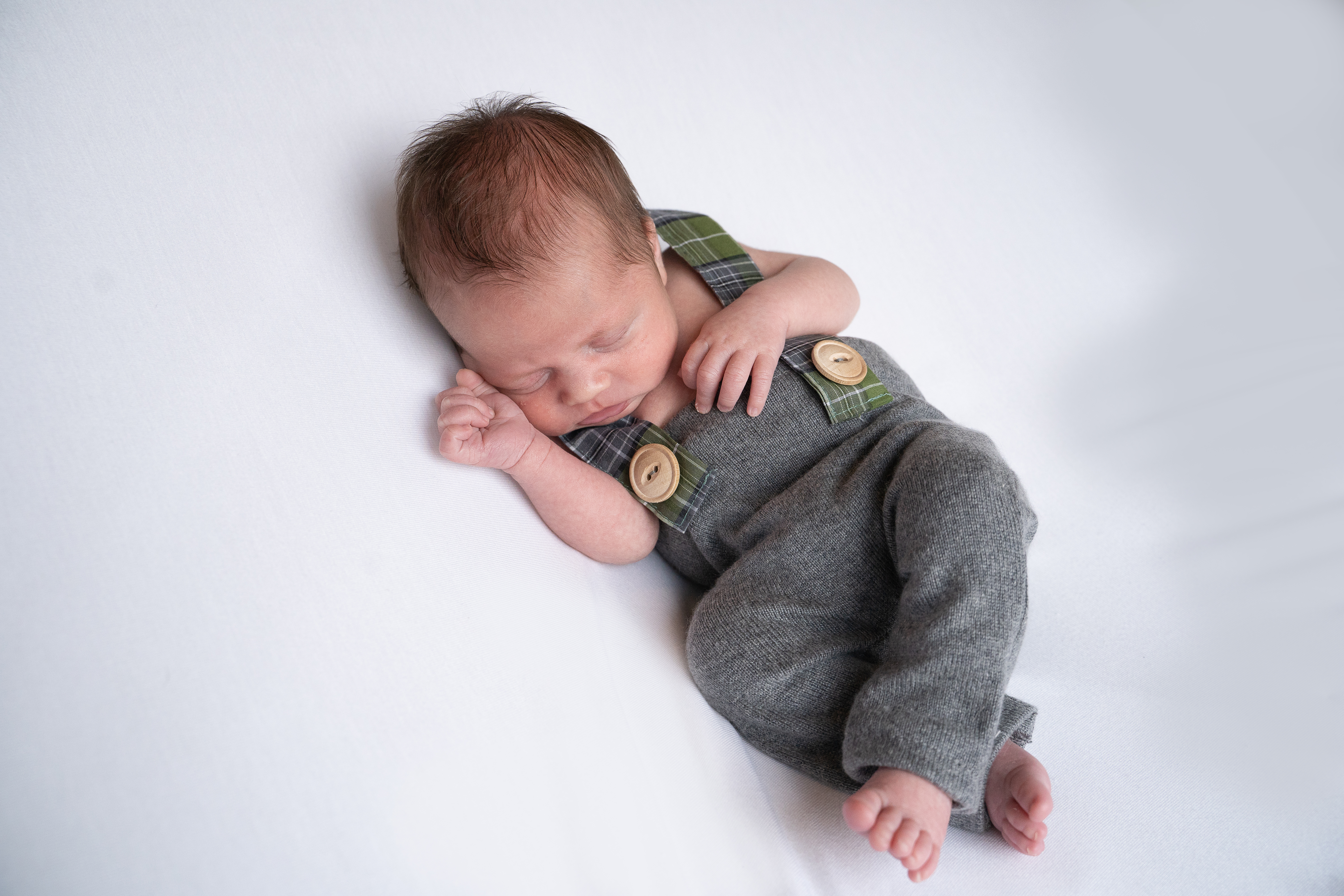 Baby in dungarees newborn