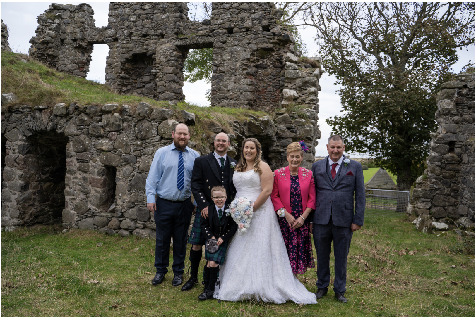 Wedding group shot at castle ruins